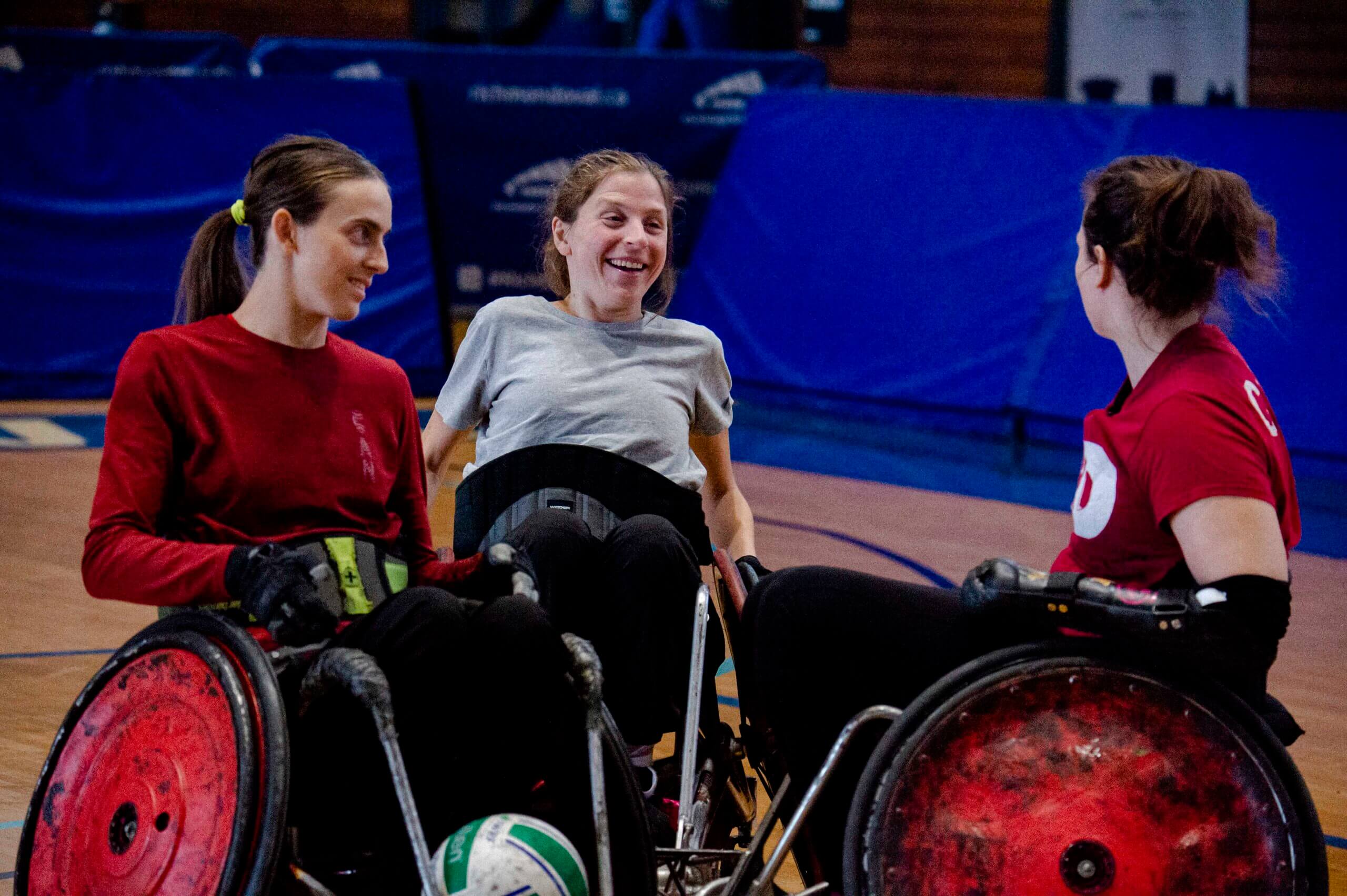 Marta smiling at a wheelchair rugby club practice